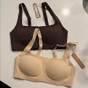 SKIMS Chocolate and Beige Bras